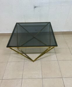A modern, square coffee table featuring a dark or smoked glass top and a cohesive, diamond-inspired geometric base made of metal or polished gold-tone steel. - Image 9