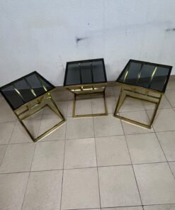 "Zicon" side table set featuring a contemporary geometric Z-shaped design, with gold-finished stainless steel or metal bases and dark or reflective glass tops. - Image 5