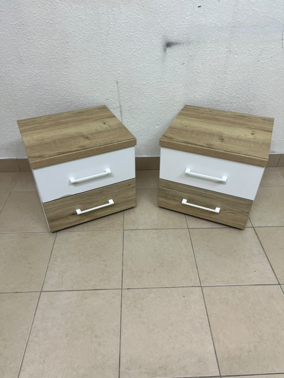 Two bedside tables (nightstands) with two drawers, featuring a design that combines white and light wood (oak or Sonoma finish) with prominent white handles. - Image 2
