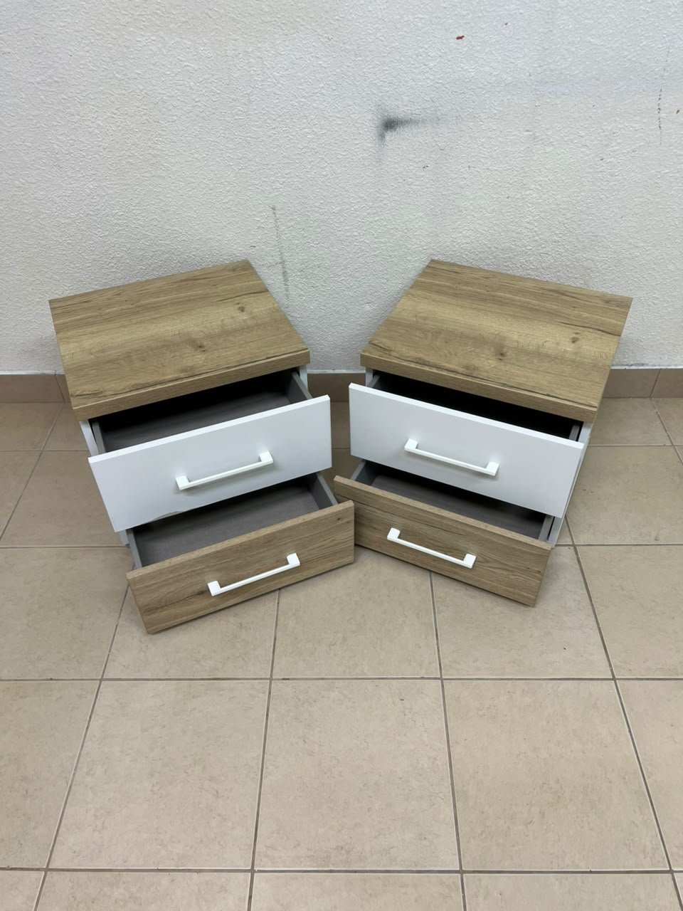 Two bedside tables (nightstands) with two drawers, featuring a design that combines white and light wood (oak or Sonoma finish) with prominent white handles. - Image 5