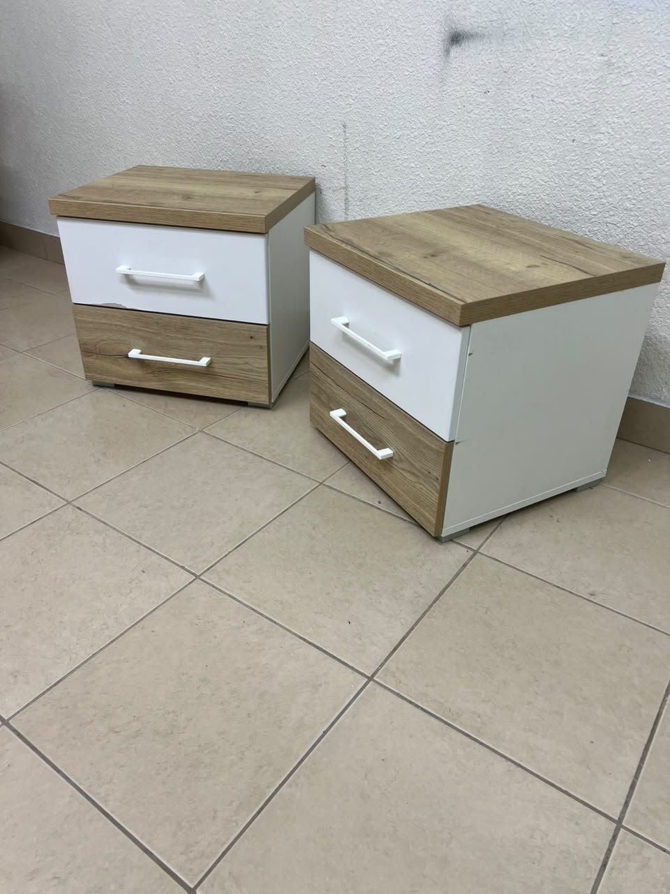 Two bedside tables (nightstands) with two drawers, featuring a design that combines white and light wood (oak or Sonoma finish) with prominent white handles. - Image 3