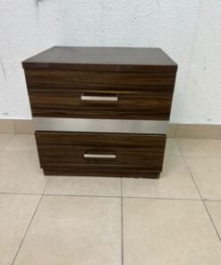 wooden bedside table with two drawers and metal handles.
