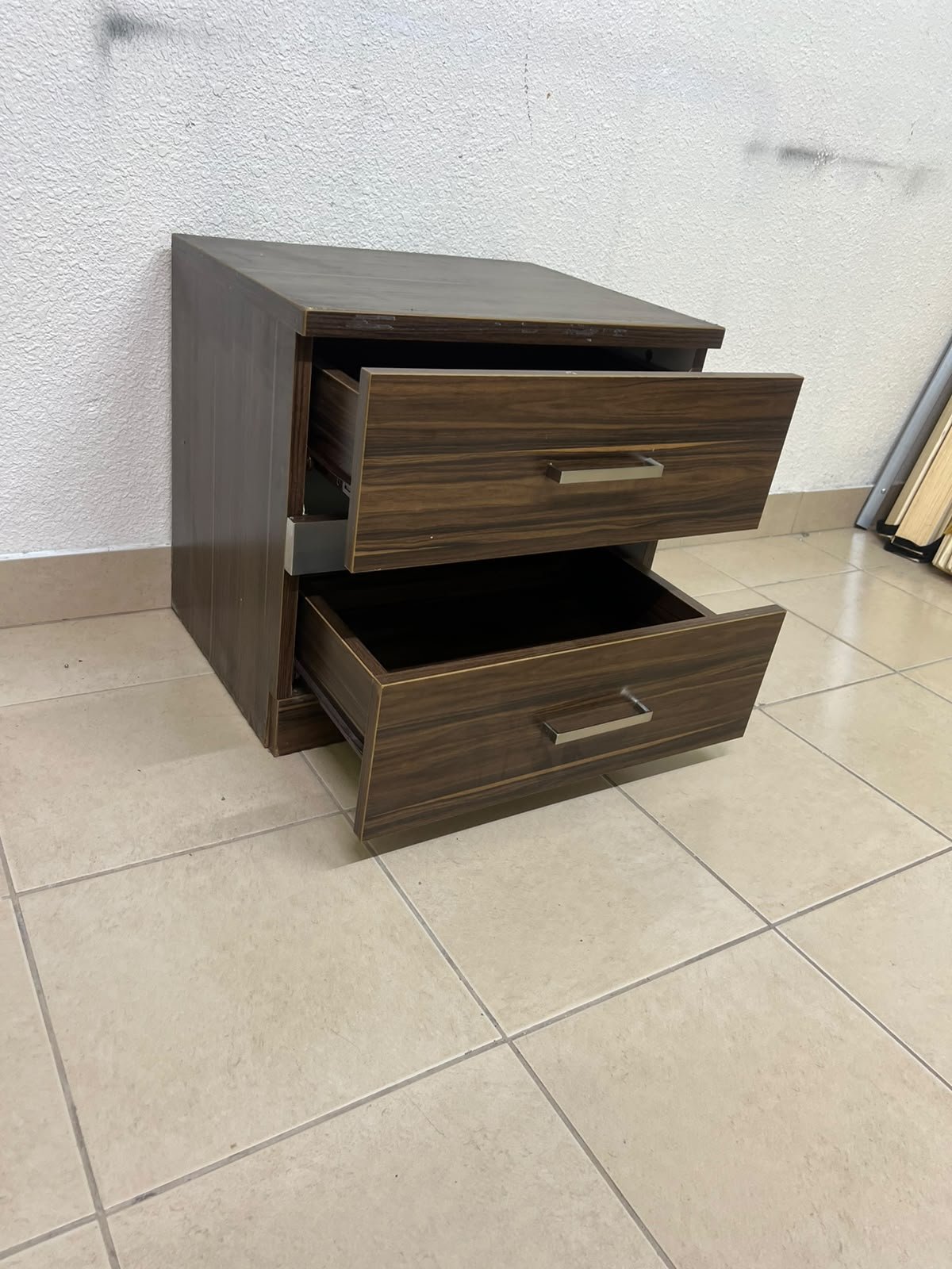 wooden bedside table with two drawers and metal handles. - Image 9