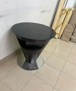 A modern, cone-shaped coffee or side table featuring a circular metal base and a round tabletop. It includes an integrated side opening—suitable for use as a cup holder or small storage unit—and boasts a sleek, streamlined design that is ideal for compact spaces. - Image 3