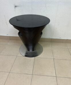 A modern, cone-shaped coffee or side table featuring a circular metal base and a round tabletop. It includes an integrated side opening—suitable for use as a cup holder or small storage unit—and boasts a sleek, streamlined design that is ideal for compact spaces. - Image 2