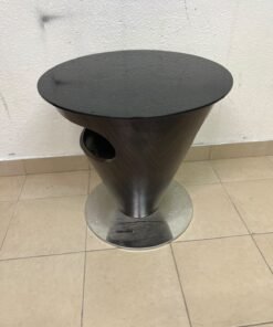 A modern, cone-shaped coffee or side table featuring a circular metal base and a round tabletop. It includes an integrated side opening—suitable for use as a cup holder or small storage unit—and boasts a sleek, streamlined design that is ideal for compact spaces.