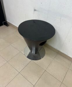 A modern, cone-shaped coffee or side table featuring a circular metal base and a round tabletop. It includes an integrated side opening—suitable for use as a cup holder or small storage unit—and boasts a sleek, streamlined design that is ideal for compact spaces. - Image 9