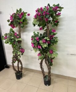 An artificial Bougainvillea tree featuring attractive pink blossoms and green foliage, distinguished by natural, expertly braided wooden trunks and set in black plastic pots. - Image 2
