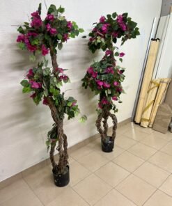 An artificial Bougainvillea tree featuring attractive pink blossoms and green foliage, distinguished by natural, expertly braided wooden trunks and set in black plastic pots. - Image 5