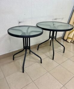 A round garden table featuring a black metal frame and a tempered glass top, suitable for outdoor use on balconies or in gardens. - Image 2