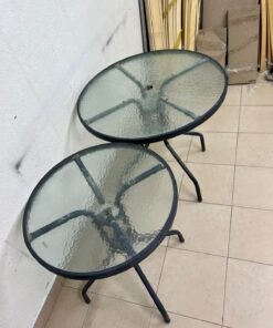 A round garden table featuring a black metal frame and a tempered glass top, suitable for outdoor use on balconies or in gardens. - Image 3