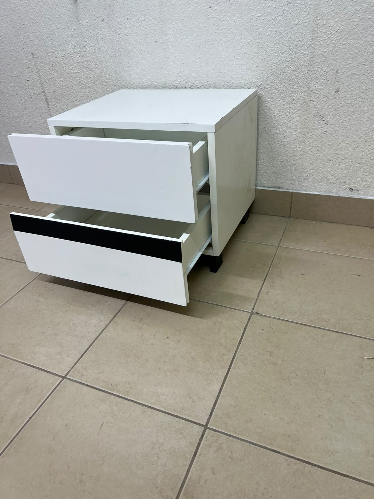 A modern-design bedside table (nightstand) made of engineered wood in white, featuring contrasting black lines. - Image 2