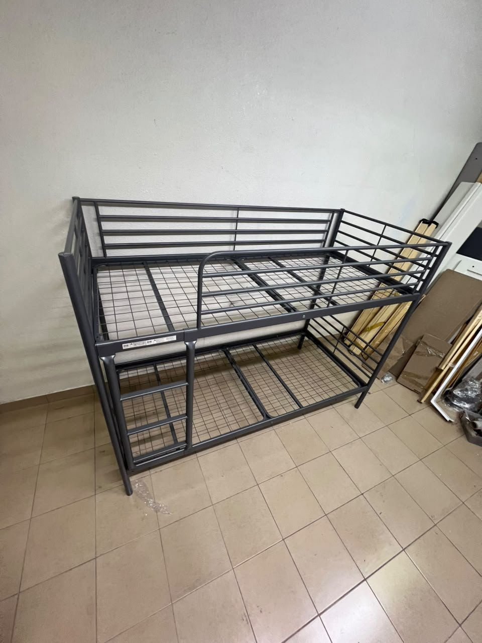 A metal bunk bed (similar to a metal bunk bed of a comparable style on Noon) featuring a solid iron frame with a built-in ladder and a mesh base. - Image 3
