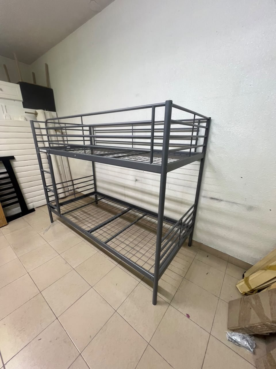 A metal bunk bed (similar to a metal bunk bed of a comparable style on Noon) featuring a solid iron frame with a built-in ladder and a mesh base. - Image 5