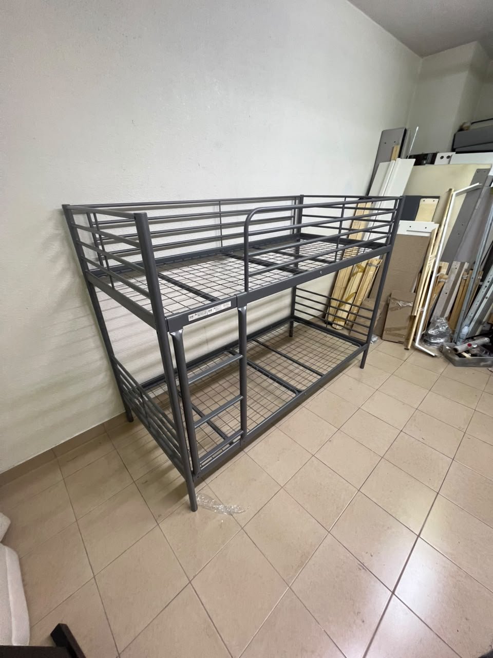 A metal bunk bed (similar to a metal bunk bed of a comparable style on Noon) featuring a solid iron frame with a built-in ladder and a mesh base. - Image 6