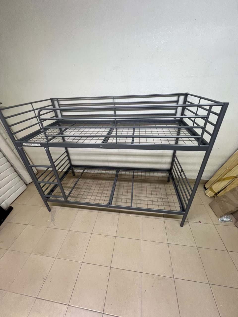 A metal bunk bed (similar to a metal bunk bed of a comparable style on Noon) featuring a solid iron frame with a built-in ladder and a mesh base. - Image 7