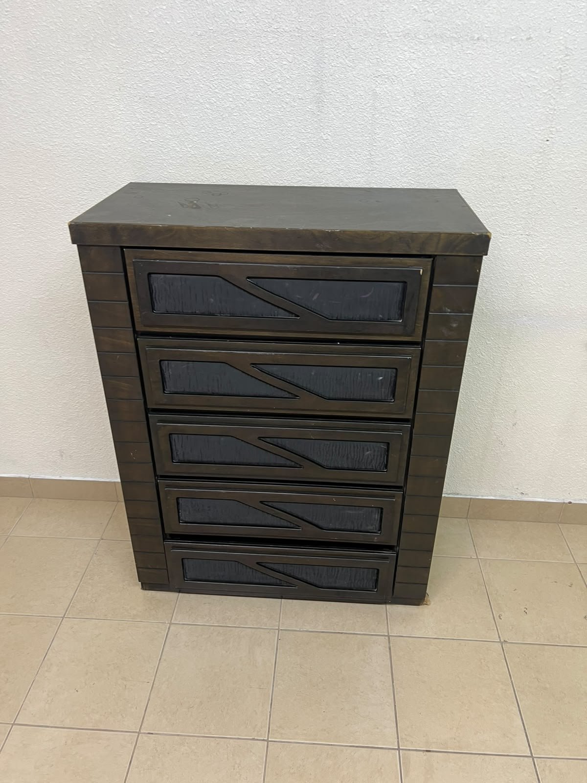 A tall, 5-drawer wooden chest featuring a dark walnut finish and a front design with raised geometric patterns. - Image 10