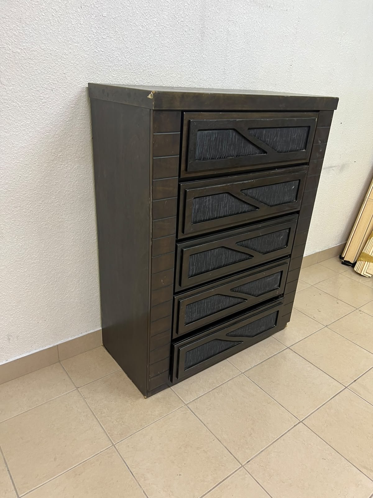 A tall, 5-drawer wooden chest featuring a dark walnut finish and a front design with raised geometric patterns. - Image 2