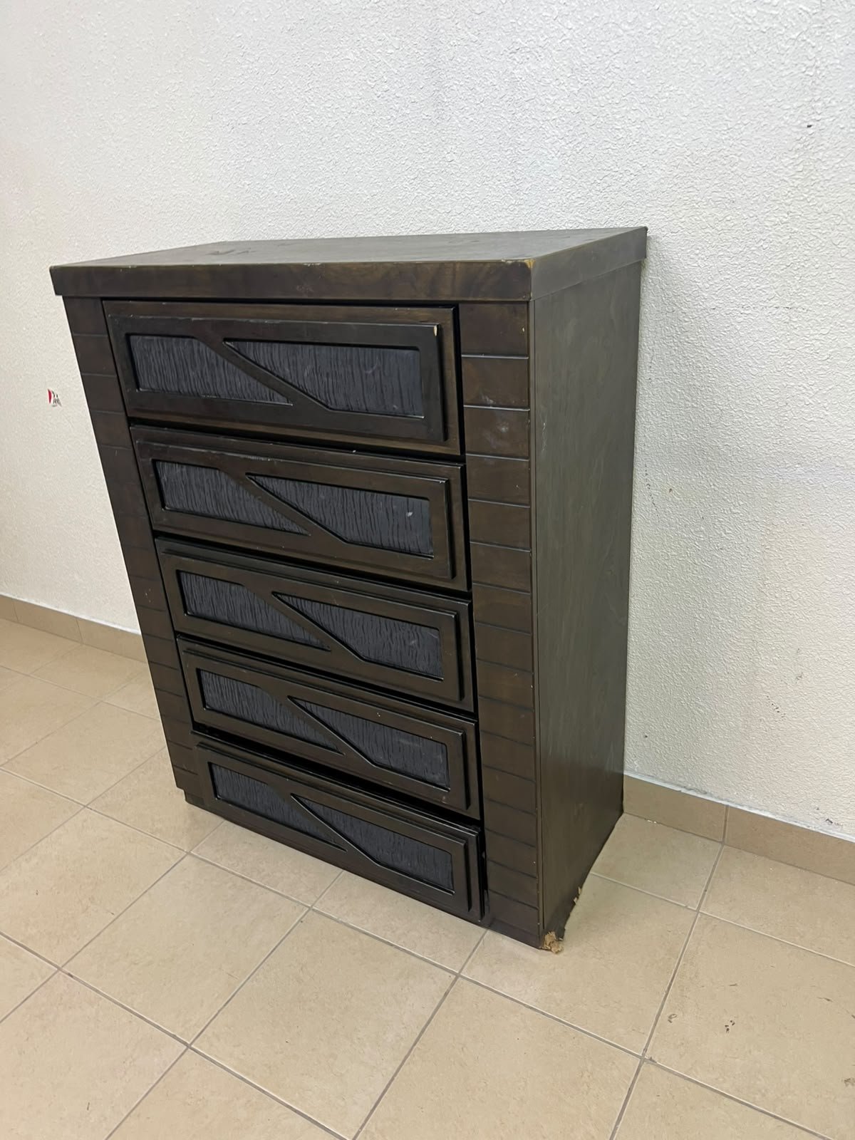 A tall, 5-drawer wooden chest featuring a dark walnut finish and a front design with raised geometric patterns. - Image 5