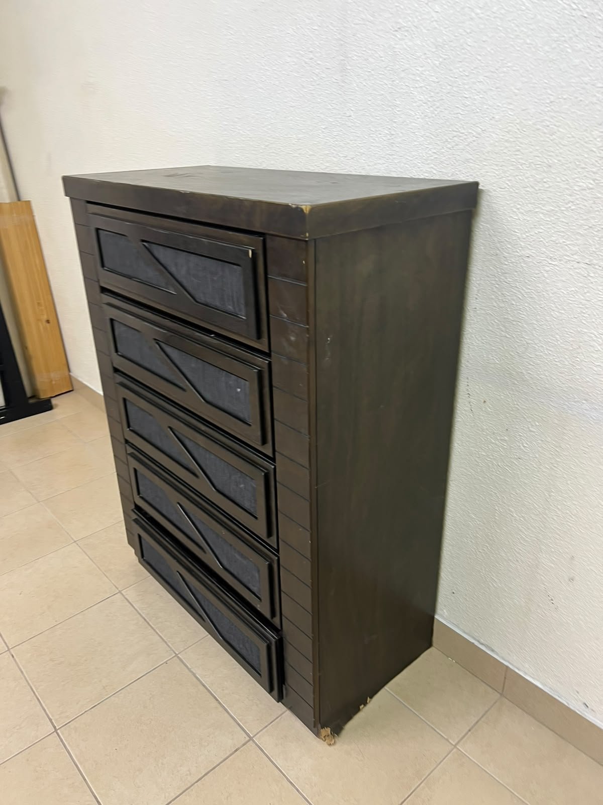A tall, 5-drawer wooden chest featuring a dark walnut finish and a front design with raised geometric patterns. - Image 6