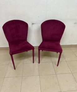 A pair of burgundy velvet dining chairs featuring a vertically ribbed backrest, sturdy metal legs, and an armless design. - Image 7