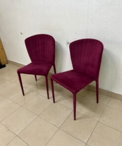 A pair of burgundy velvet dining chairs featuring a vertically ribbed backrest, sturdy metal legs, and an armless design. - Image 11