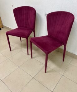 A pair of burgundy velvet dining chairs featuring a vertically ribbed backrest, sturdy metal legs, and an armless design. - Image 5