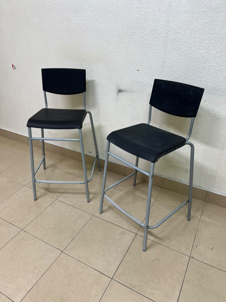 IKEA STIG bar stools, featuring a black seat and backrest with a grey metal frame. - Image 8