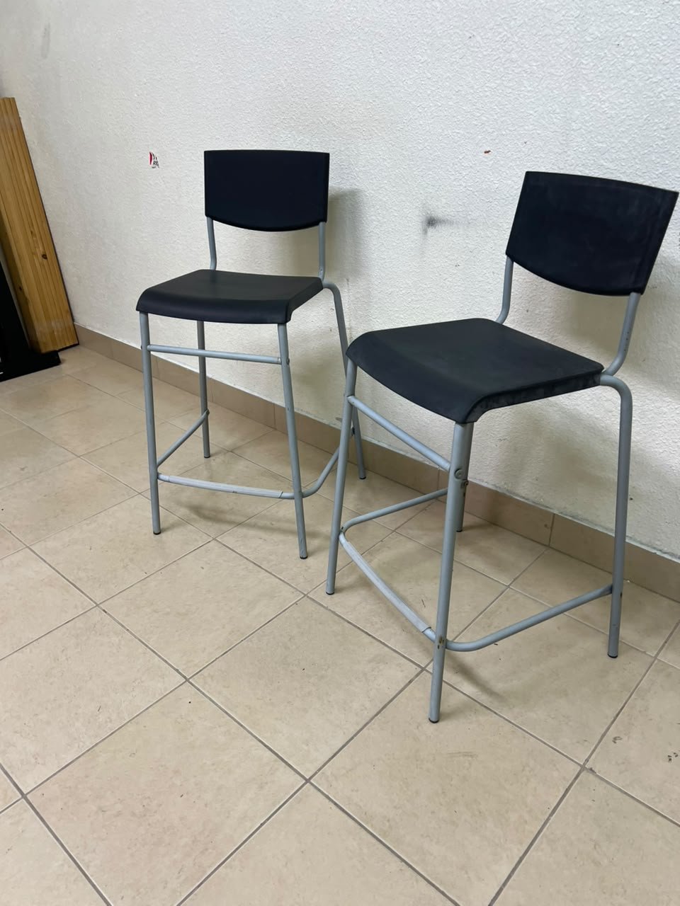 IKEA STIG bar stools, featuring a black seat and backrest with a grey metal frame. - Image 10