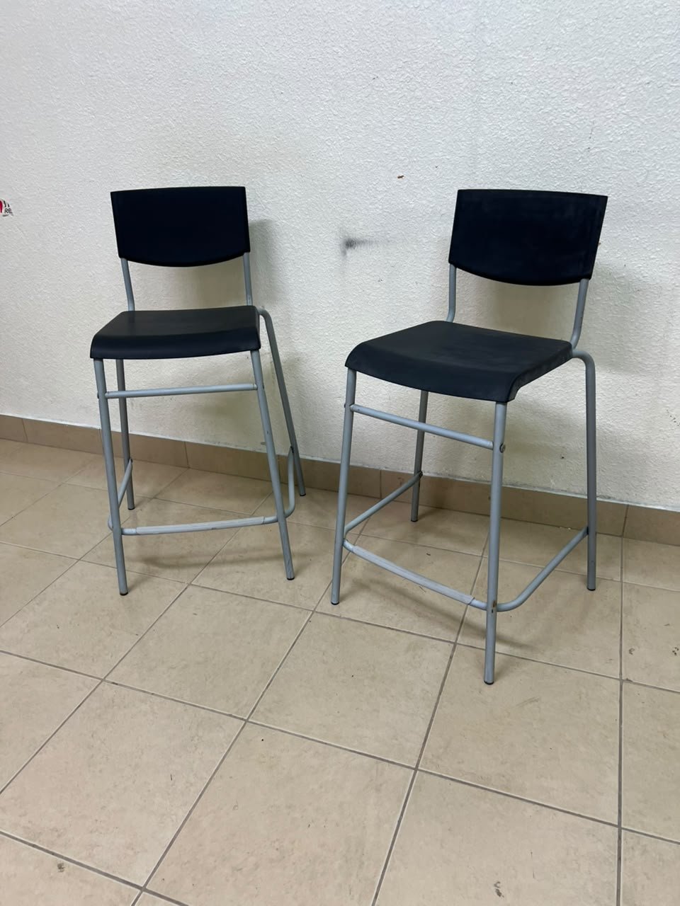 IKEA STIG bar stools, featuring a black seat and backrest with a grey metal frame. - Image 12