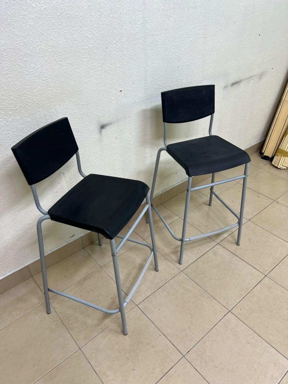 IKEA STIG bar stools, featuring a black seat and backrest with a grey metal frame. - Image 2