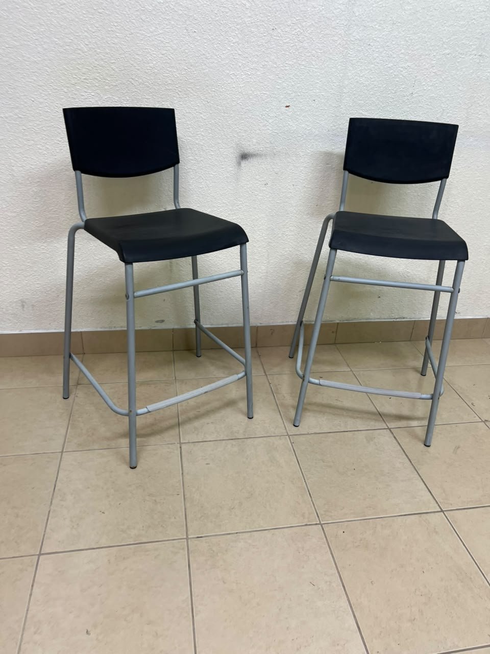 IKEA STIG bar stools, featuring a black seat and backrest with a grey metal frame. - Image 4