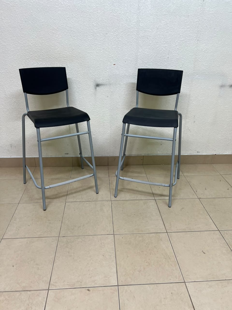 IKEA STIG bar stools, featuring a black seat and backrest with a grey metal frame. - Image 6