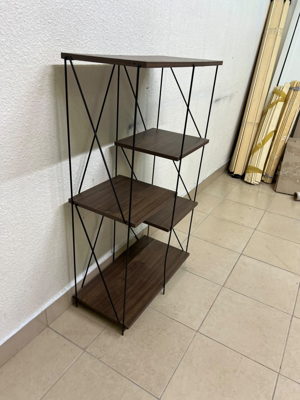 Multi-tiered open shelving units or similar industrial storage racks featuring black metal frames and walnut-colored wooden shelves. - Image 4