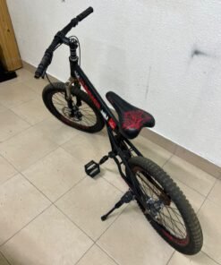 A 20-inch "Hummer"-branded mountain bike featuring a black and red color scheme; it appears to be equipped with a carbon steel or alloy frame, a front suspension system, and dual disc brakes. - Image 2