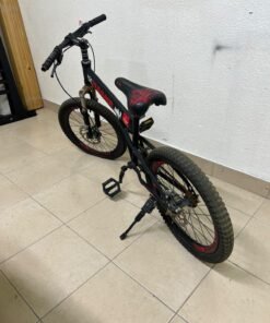 A 20-inch "Hummer"-branded mountain bike featuring a black and red color scheme; it appears to be equipped with a carbon steel or alloy frame, a front suspension system, and dual disc brakes. - Image 4