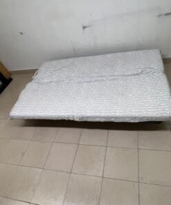A foldable metal sofa bed (converting into a bed)—the famous IKEA NYHAMN model—featuring a grey-and-white patterned fabric cover and a black frame. - Image 4