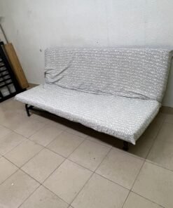 A foldable metal sofa bed (converting into a bed)—the famous IKEA NYHAMN model—featuring a grey-and-white patterned fabric cover and a black frame. - Image 9