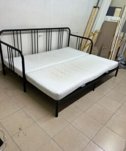 This is a black metal daybed that extends to convert into a double bed or a sofa; it closely resembles the IKEA FYRESDAL daybed frame (80x200 cm).