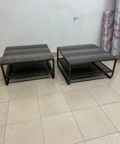 A set of two coffee tables featuring a modern industrial design; each boasts a wooden tabletop with a rustic or distressed look, a sturdy black metal frame and base, and a practical bottom shelf. - Image 6