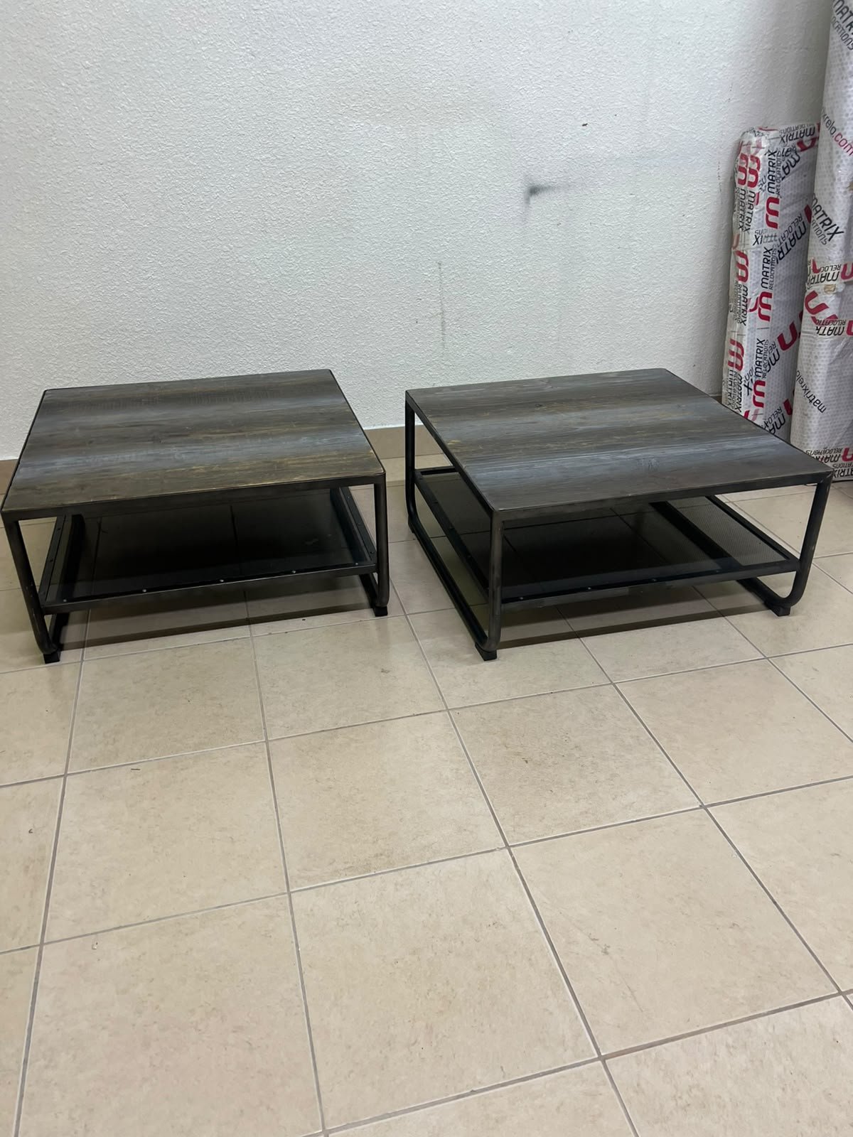 A set of two coffee tables featuring a modern industrial design; each boasts a wooden tabletop with a rustic or distressed look, a sturdy black metal frame and base, and a practical bottom shelf. - Image 6
