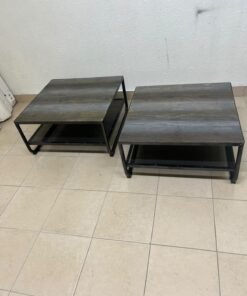 A set of two coffee tables featuring a modern industrial design; each boasts a wooden tabletop with a rustic or distressed look, a sturdy black metal frame and base, and a practical bottom shelf. - Image 4