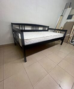 The image appears to show a dark black wooden daybed, featuring rails on three sides and a standard double size with a white mattress. - Image 2