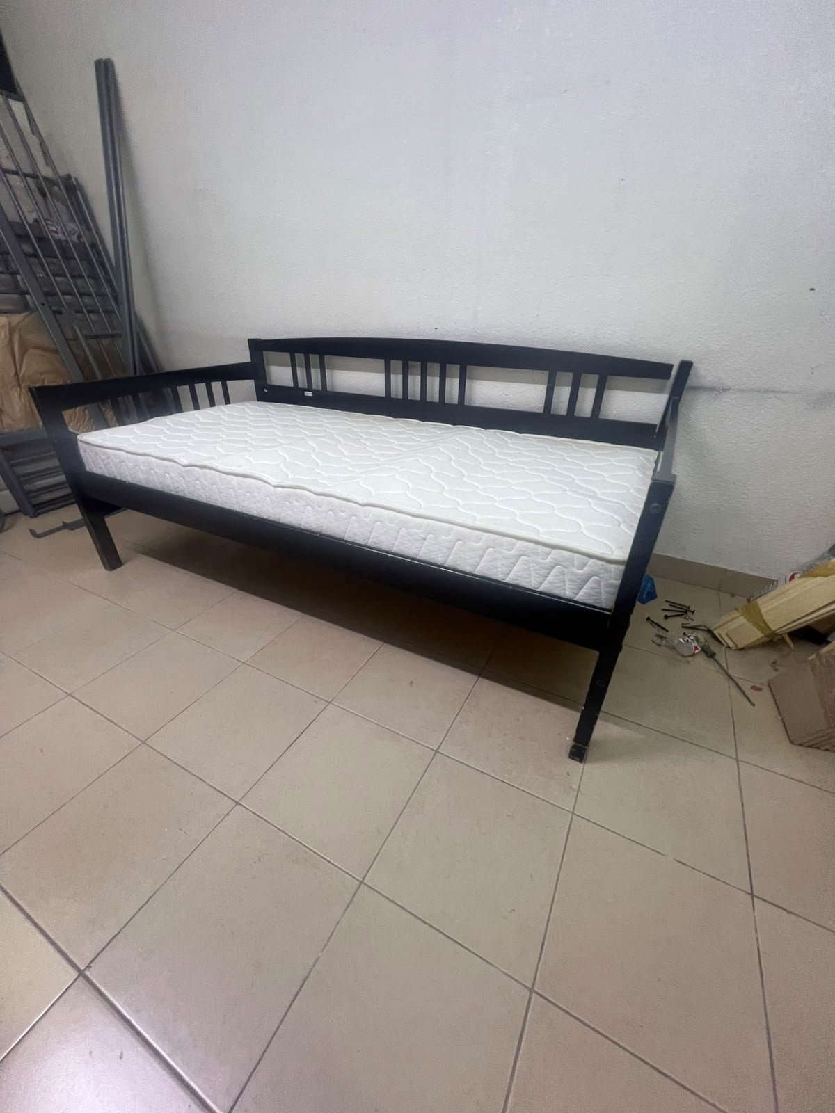 The image appears to show a dark black wooden daybed, featuring rails on three sides and a standard double size with a white mattress. - Image 5
