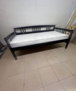 The image appears to show a dark black wooden daybed, featuring rails on three sides and a standard double size with a white mattress. - Image 13