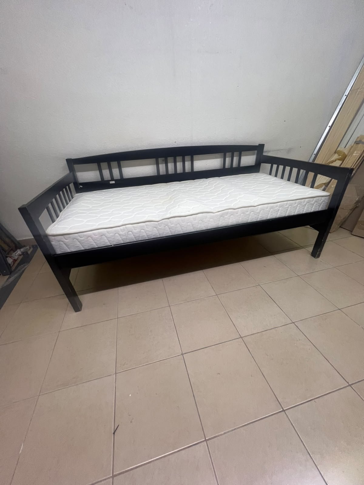 The image appears to show a dark black wooden daybed, featuring rails on three sides and a standard double size with a white mattress. - Image 13