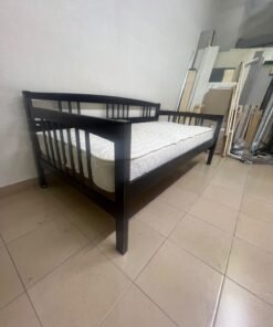 The image appears to show a dark black wooden daybed, featuring rails on three sides and a standard double size with a white mattress. - Image 12