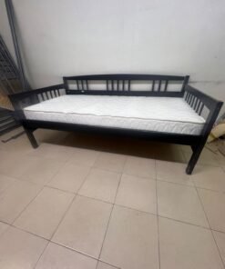 The image appears to show a dark black wooden daybed, featuring rails on three sides and a standard double size with a white mattress. - Image 10