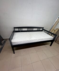 The image appears to show a dark black wooden daybed, featuring rails on three sides and a standard double size with a white mattress. - Image 9
