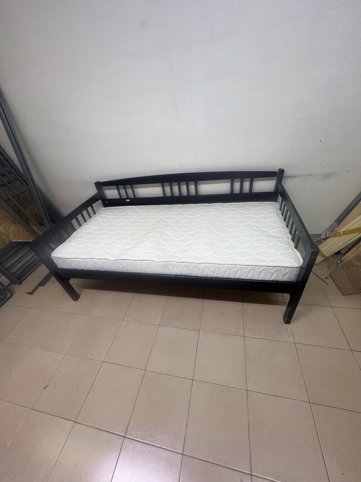 The image appears to show a dark black wooden daybed, featuring rails on three sides and a standard double size with a white mattress. - Image 8